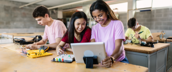 two-girls-looking-at-a-tablet