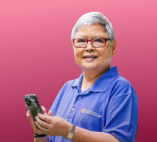 an elderly woman holding a phone